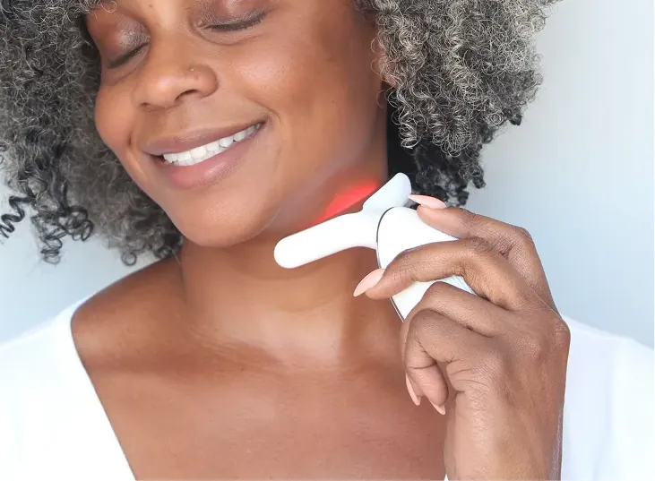 MyoGlow Neck Restore Device being used along the neck