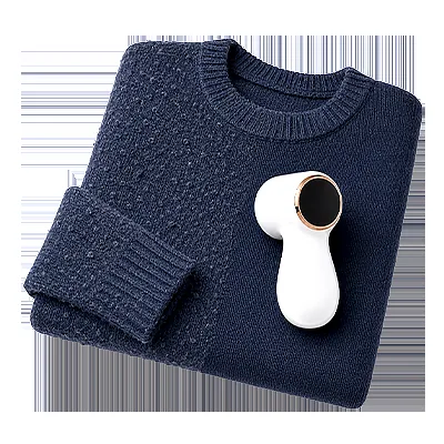 NoFuzz electric fabric shaver in use on a fabric surface