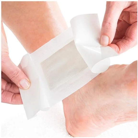 A Nuubu Detox patch being applied to the ankle