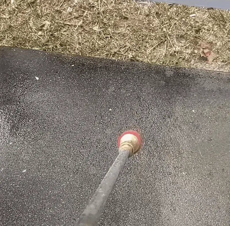 Qinux WaterBlitz hose attachment spraying water